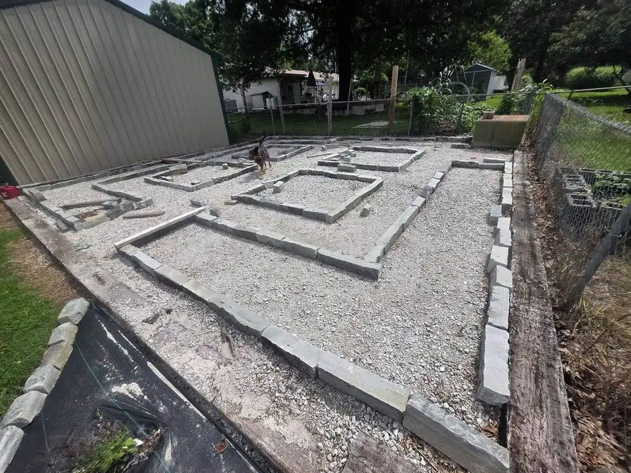 Curved brick border along a mulched bed