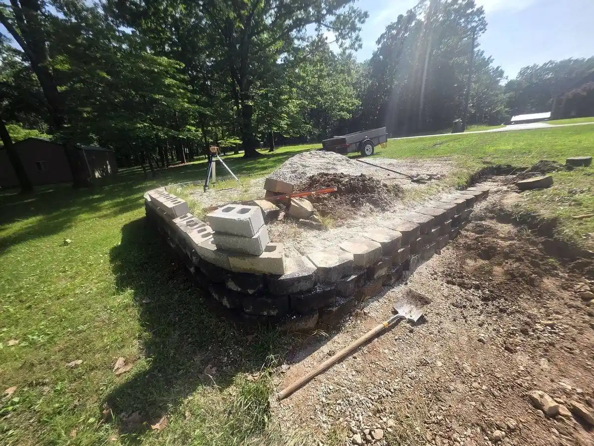 A retaining wall course being set level