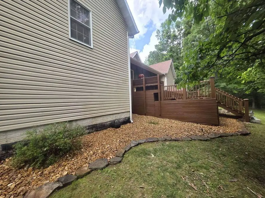 Mulch bed running along a deck and lawn